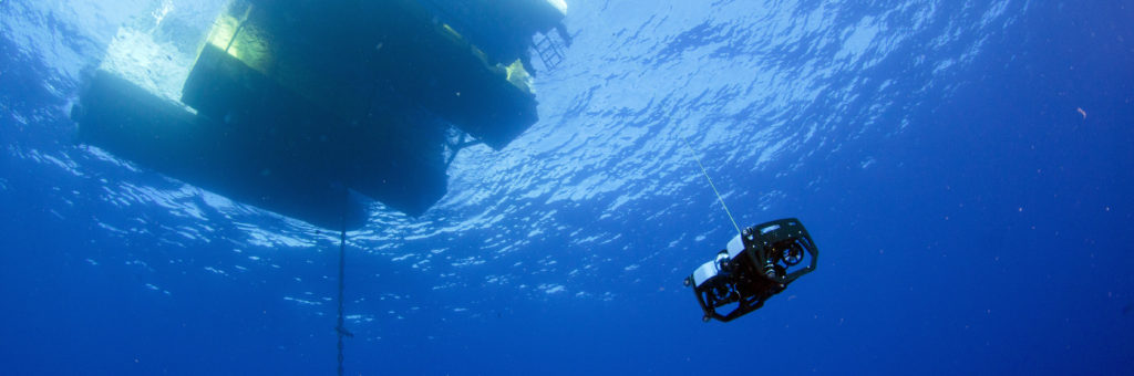 A <em>BlueROV2</em> inspecting an aquafarm. Photo credit: Jeff Milisen 