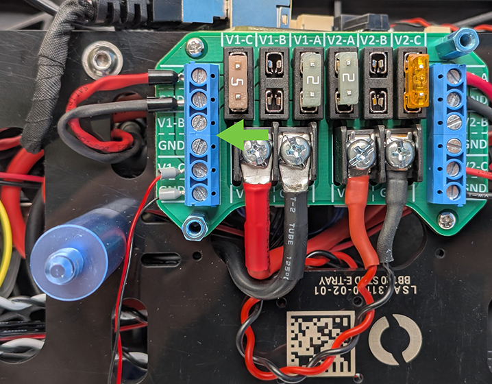 In this picture, the cable is connected to terminal V1-C, so the fuse is installed in the corresponding V1-C slot.